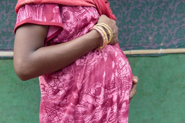 A pregnant woman in Nadi, present for an antenatal check-up during a primary health care outreach session. Gurugram district, Haryana State, India. August 2019.
